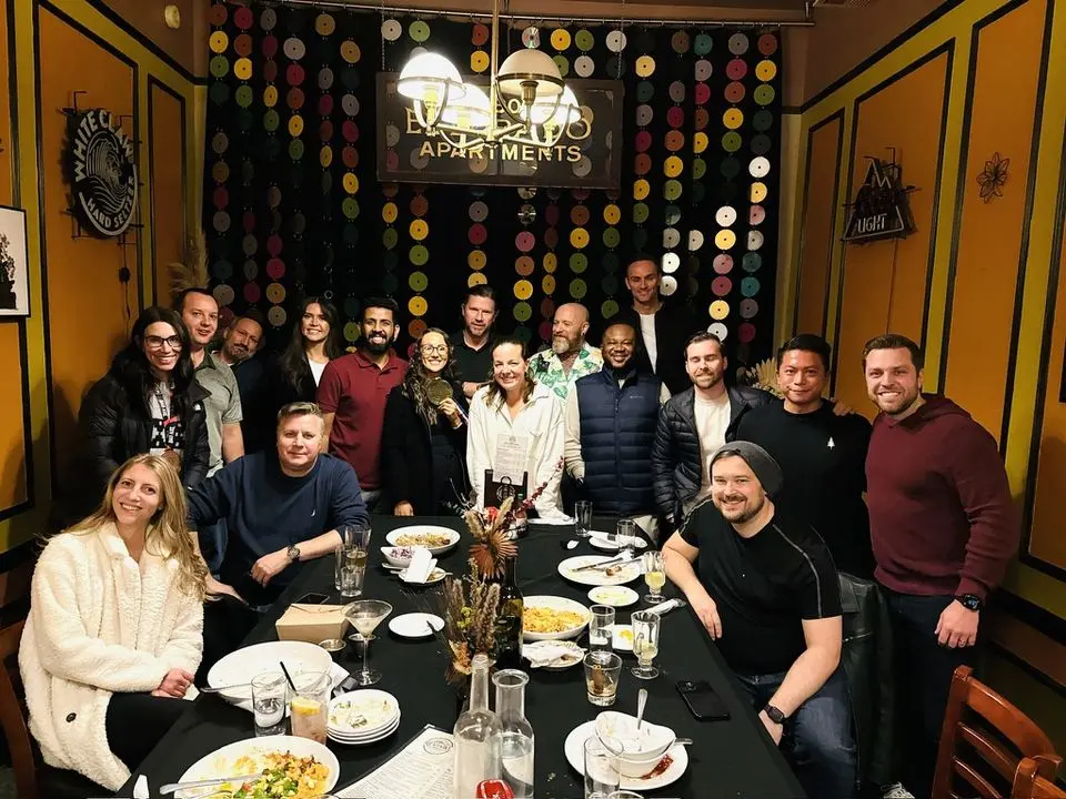 The team around a dinner table on a work trip